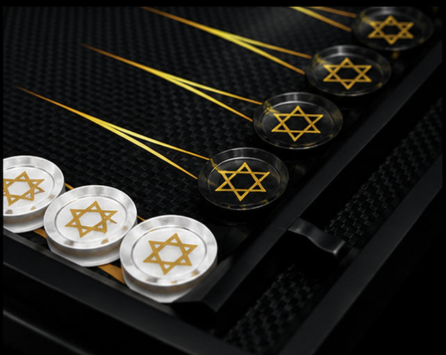 Full-frame close-up of black and white Star of David backgammon checkers