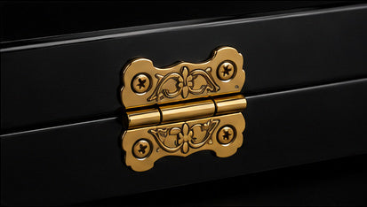 Ornate gold hinge detail on black luxury backgammon case